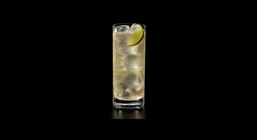 Grappa & Ginger Highball cocktail on a dark studio background