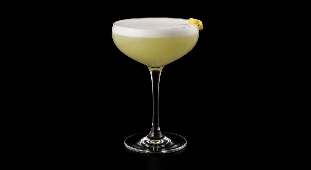 Green Fairy cocktail on a dark studio background