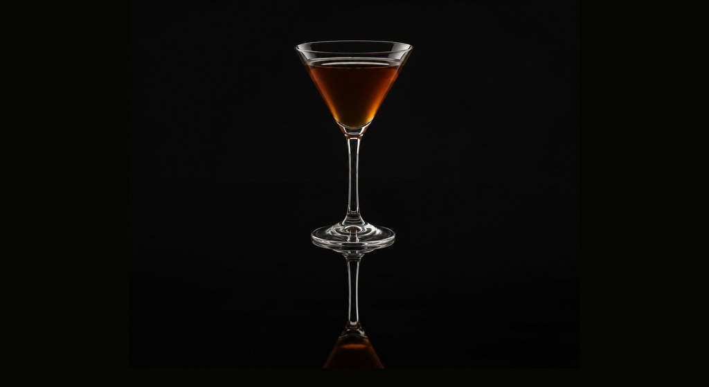 Guillotine cocktail on a dark studio background