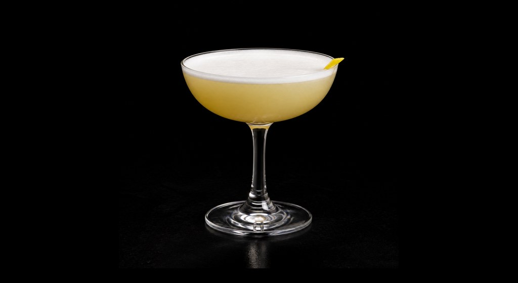 Halloween Sour cocktail on a dark studio background