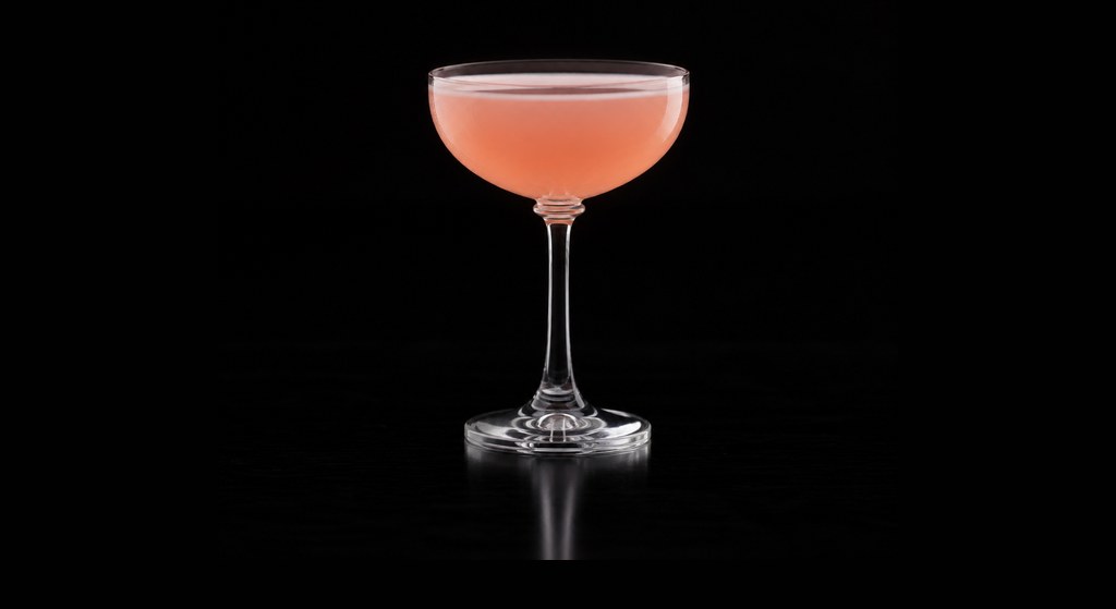 Hole in the Fence cocktail on a dark studio background
