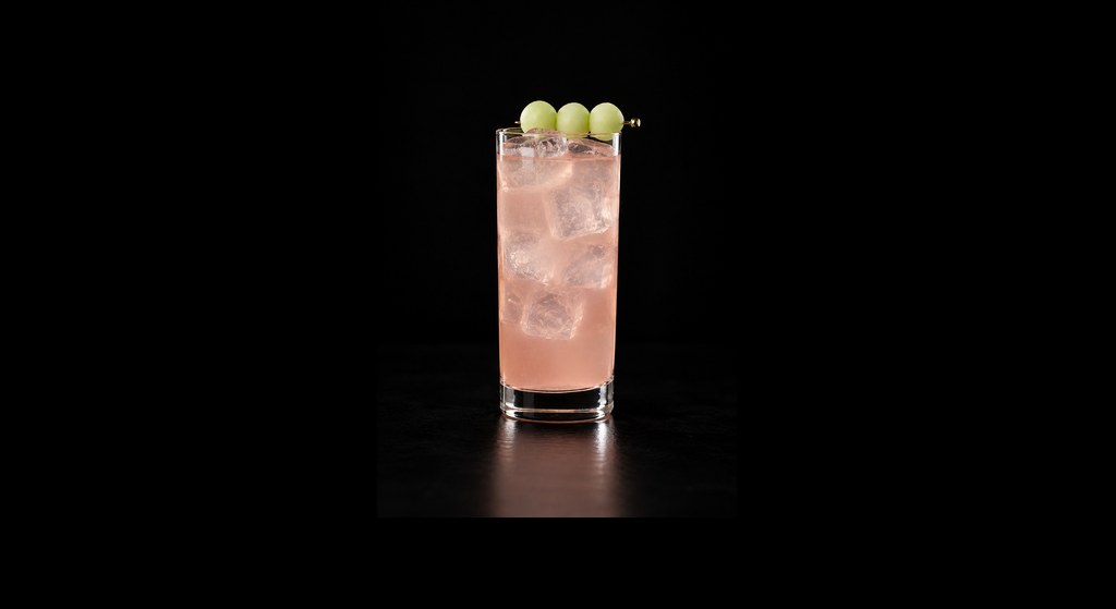 Honey Deuce cocktail on a dark studio background