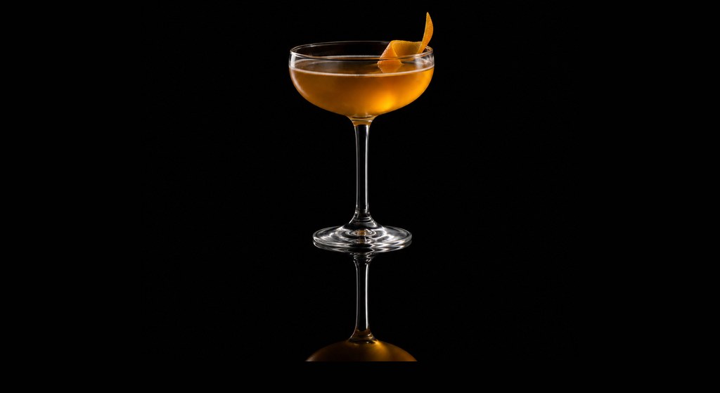 Honeymoon cocktail on a dark studio background