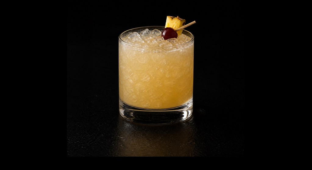 Humuhumunukunukuapua'a cocktail on a dark studio background