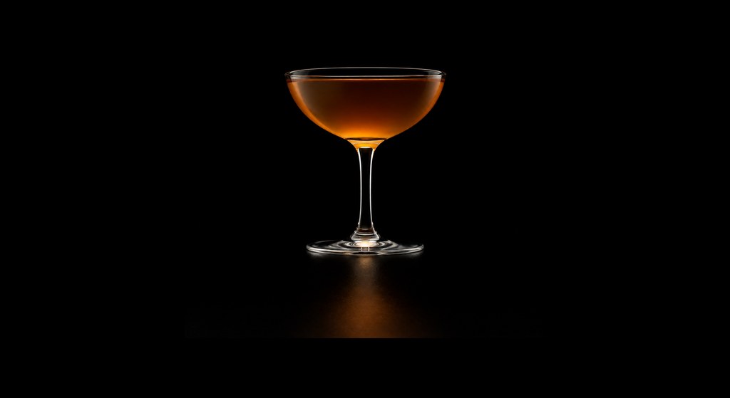 Improved Brandy Cocktail cocktail on a dark studio background