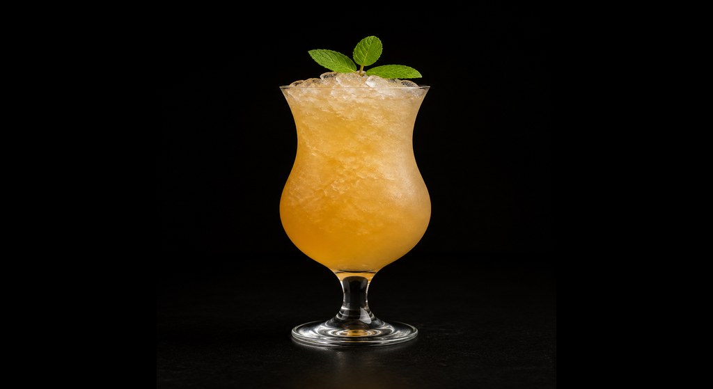 Invisible Sun cocktail on a dark studio background