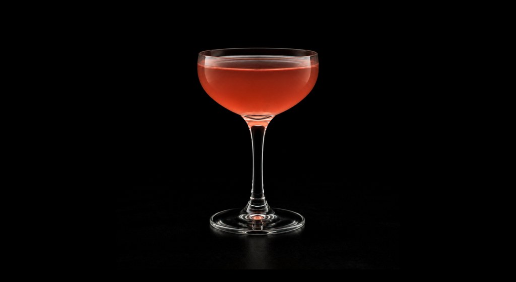 Jack Rose cocktail on a dark studio background