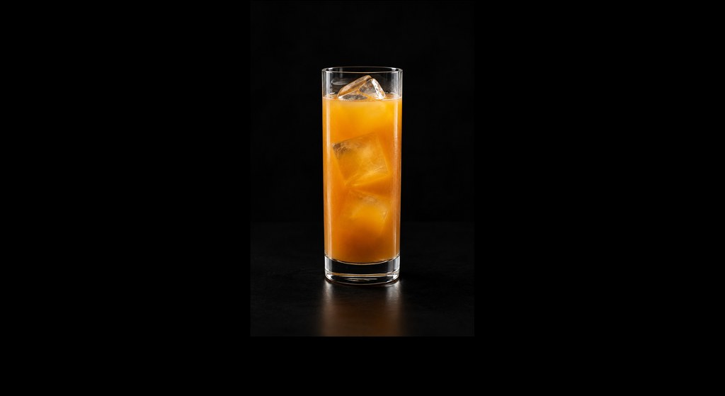 Jägermeister & Maracuja cocktail on a dark studio background