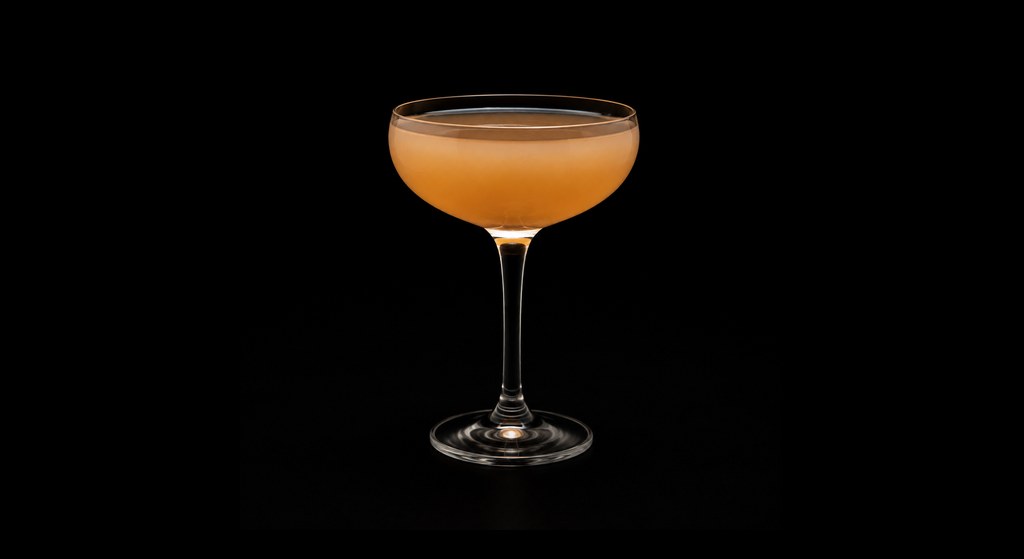 Jakartian Peardition cocktail on a dark studio background