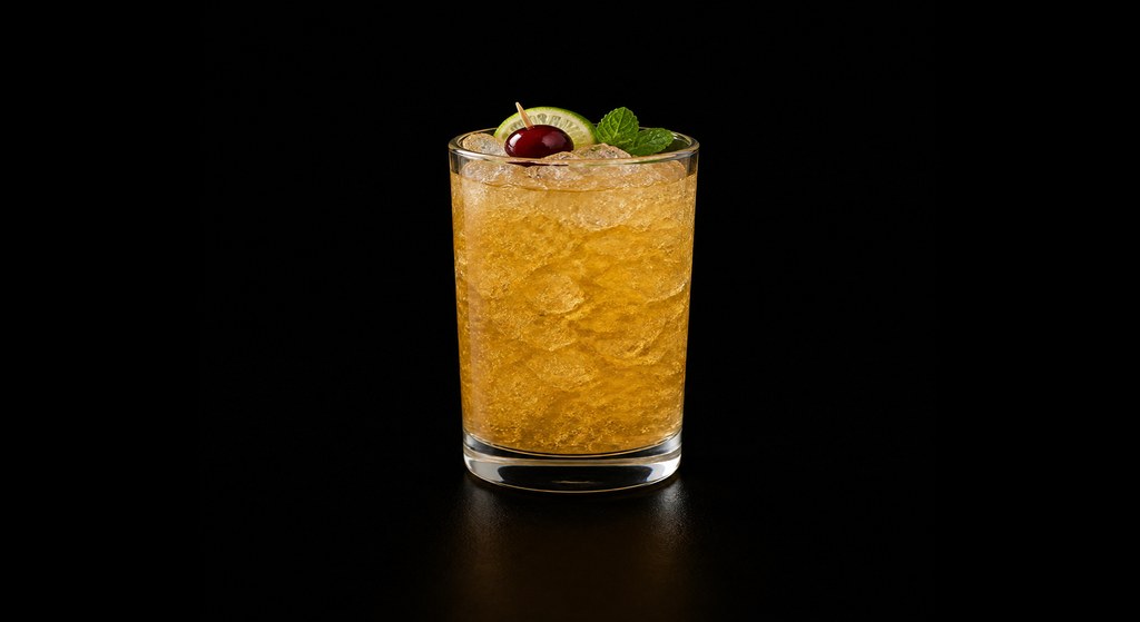 Jasper's Rum Punch cocktail on a dark studio background