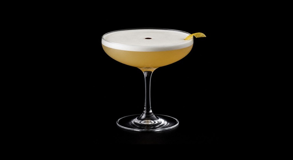 Jitterbug Sour cocktail on a dark studio background
