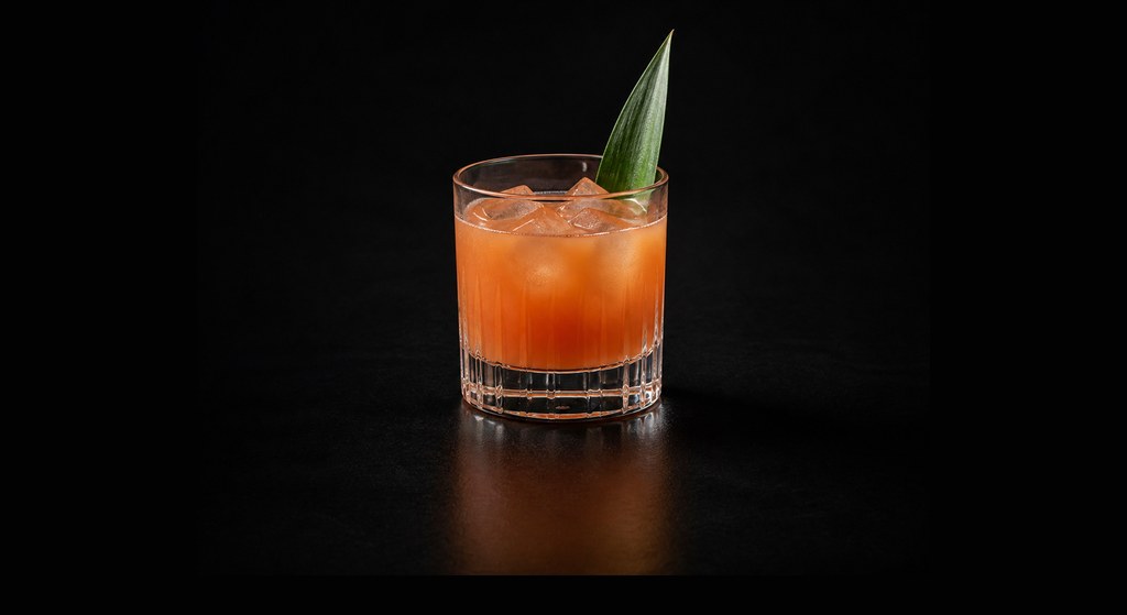 Jungle Bird cocktail on a dark studio background