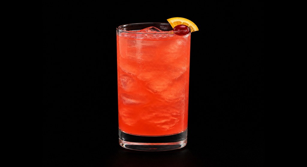 Jungle Juice cocktail on a dark studio background