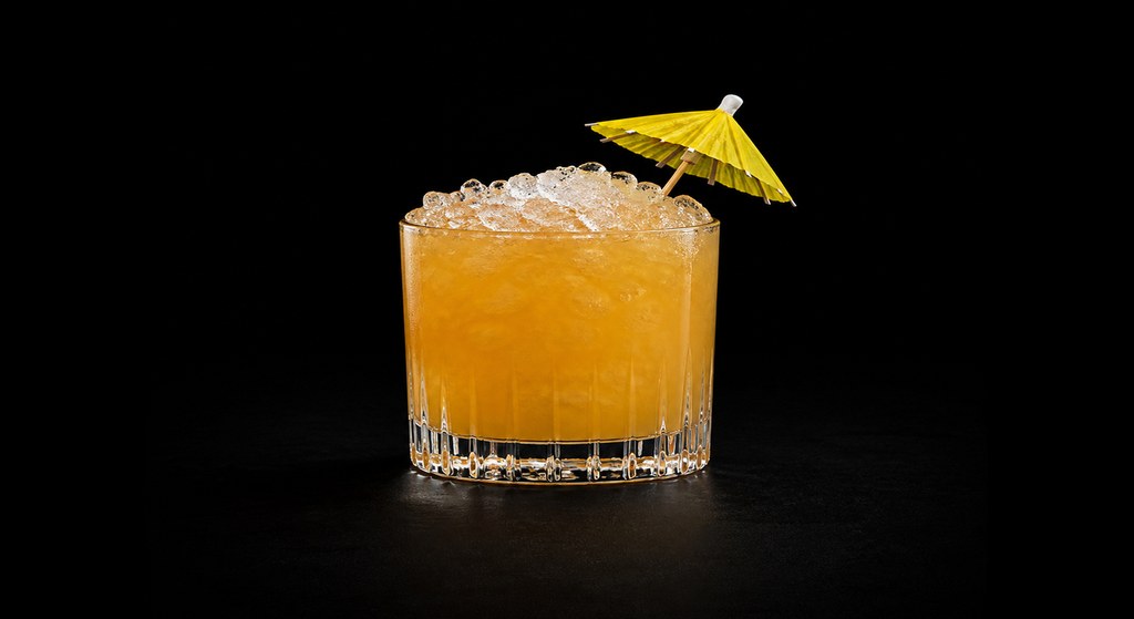 King Ghidora cocktail on a dark studio background