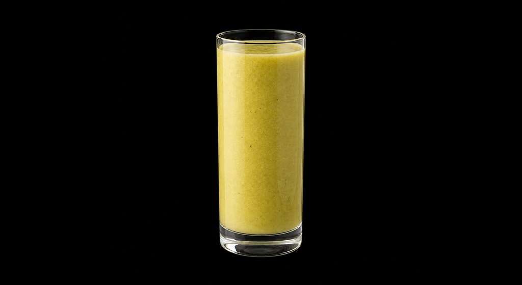 Kiwi Papaya Smoothie cocktail on a dark studio background