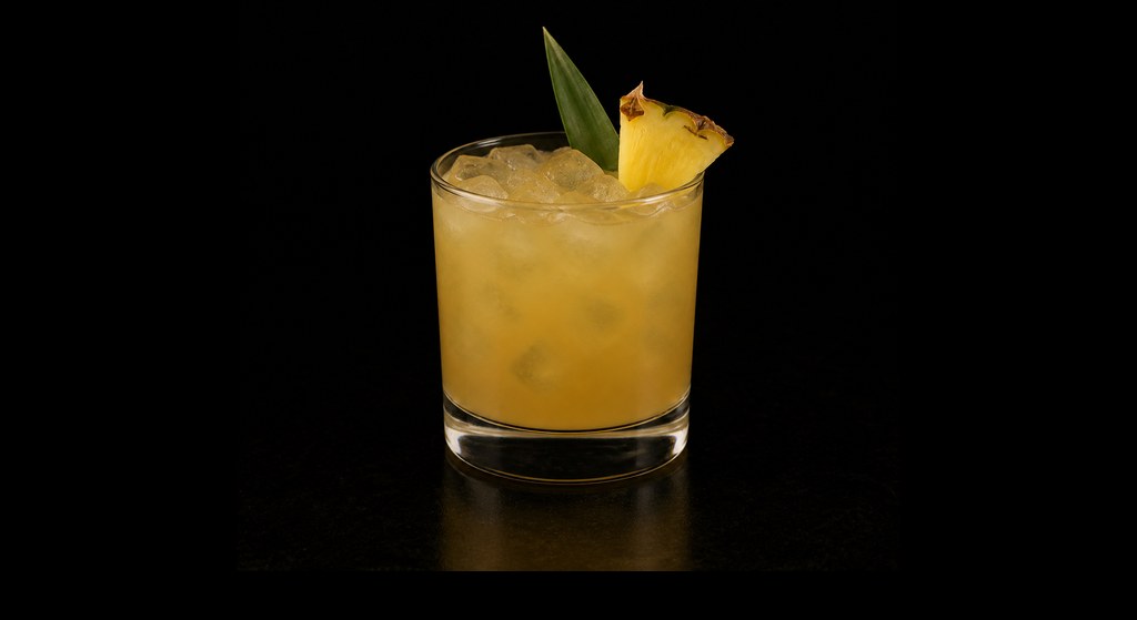 Kona Coasting cocktail on a dark studio background