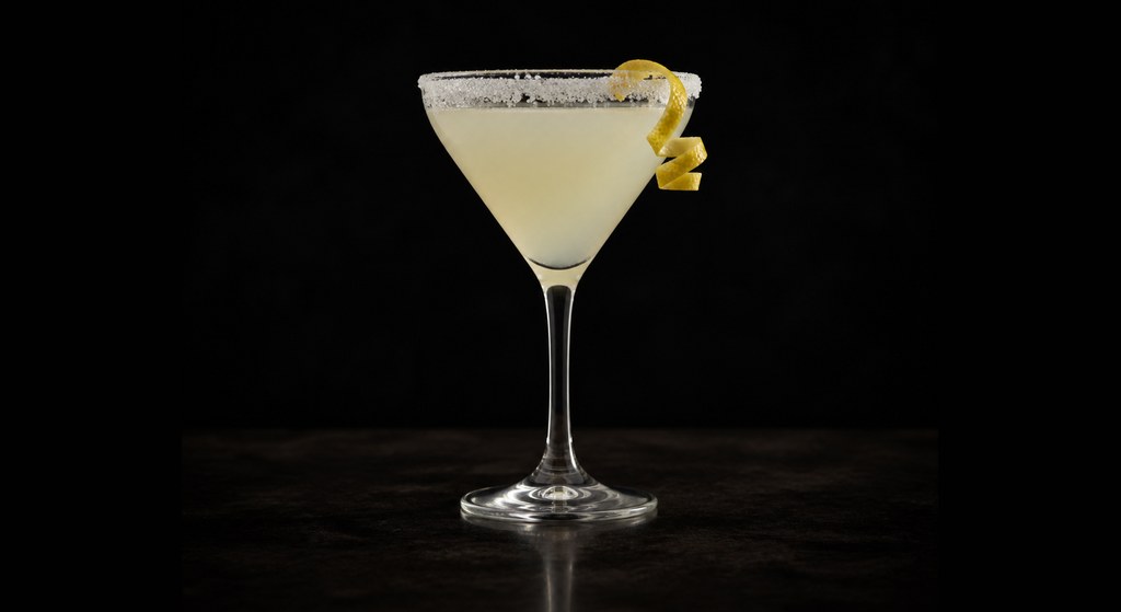 Lemon Drop cocktail on a dark studio background