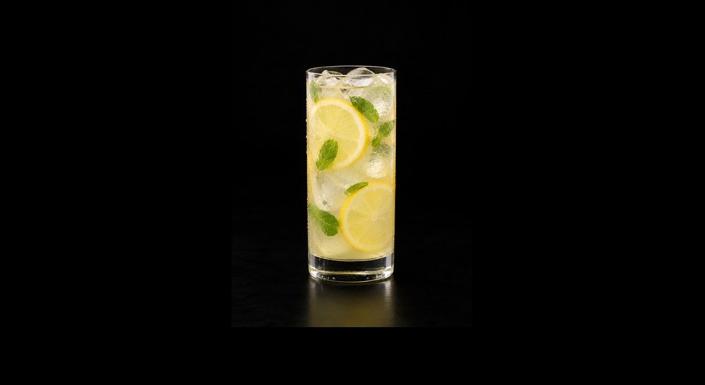 Lemon Mint Coconut Mocktail cocktail on a dark studio background