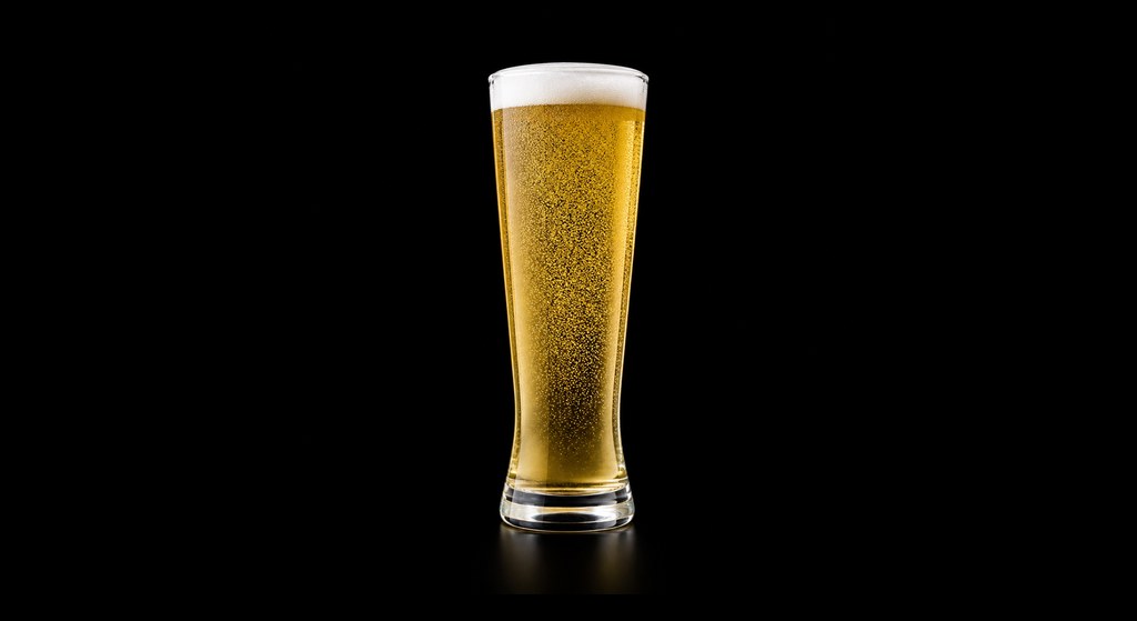 Limona Corona cocktail on a dark studio background