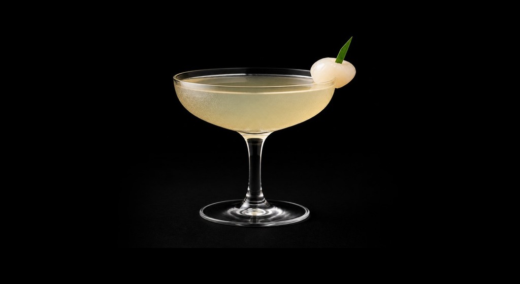 Lychee Lucy cocktail on a dark studio background