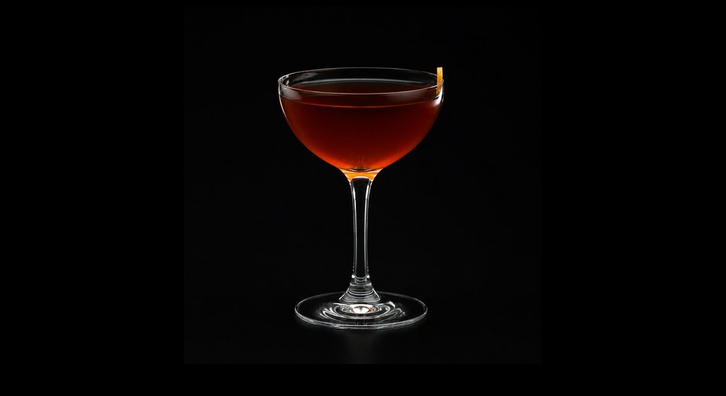 Manhattan Transfer cocktail on a dark studio background
