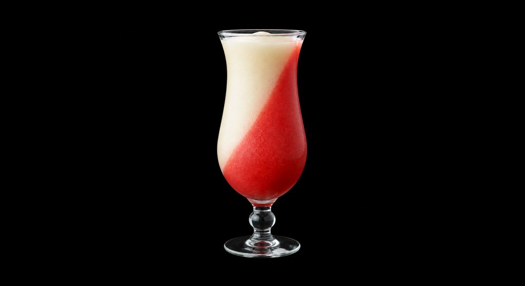Miami Vice cocktail on a dark studio background