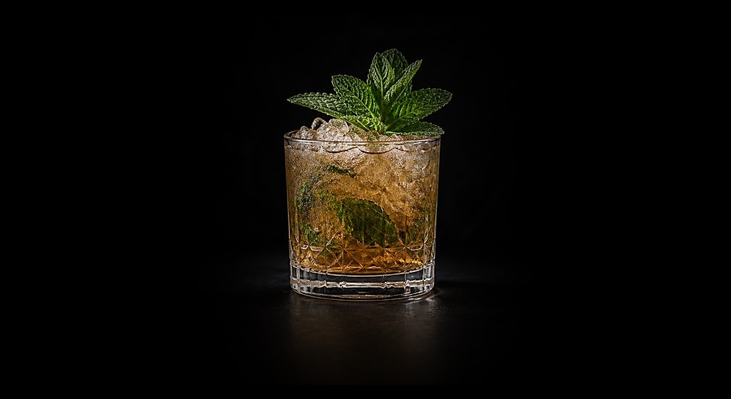 Mint Julep cocktail on a dark studio background