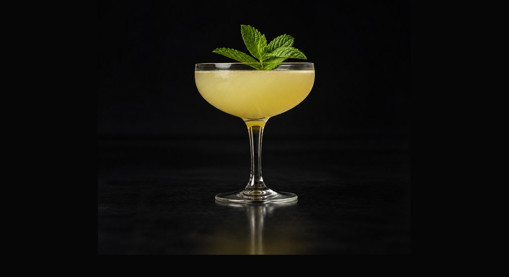 Missionary's Downfall cocktail on a dark studio background
