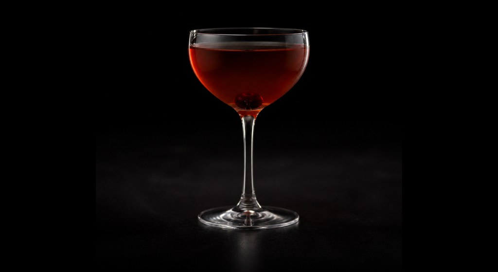 Model Village cocktail on a dark studio background