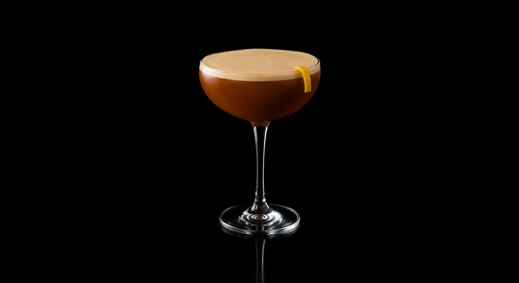 Molten Steel Flip cocktail on a dark studio background