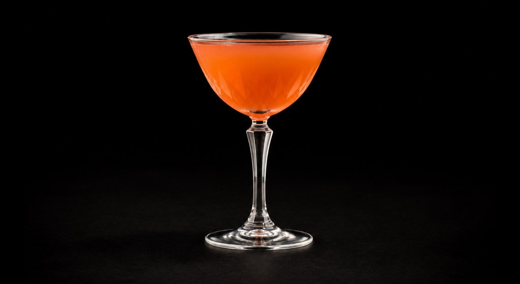 Monkey Gland cocktail on a dark studio background