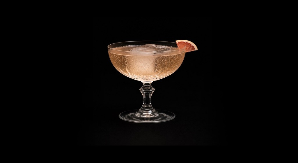 Mother's Ruin Punch cocktail on a dark studio background