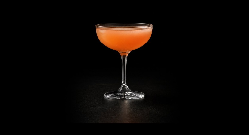 Naked and Famous cocktail on a dark studio background