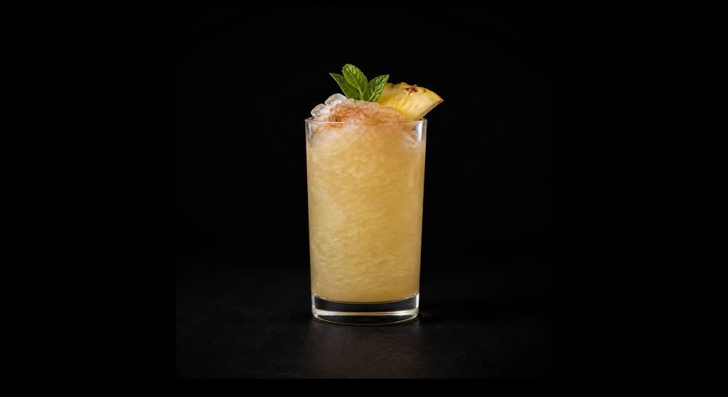 No Regerts cocktail on a dark studio background