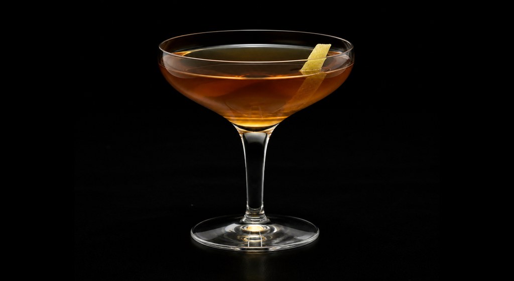 Norwegian Wood cocktail on a dark studio background
