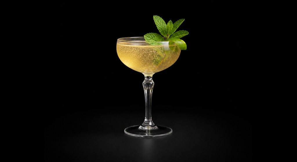 Old Cuban cocktail on a dark studio background