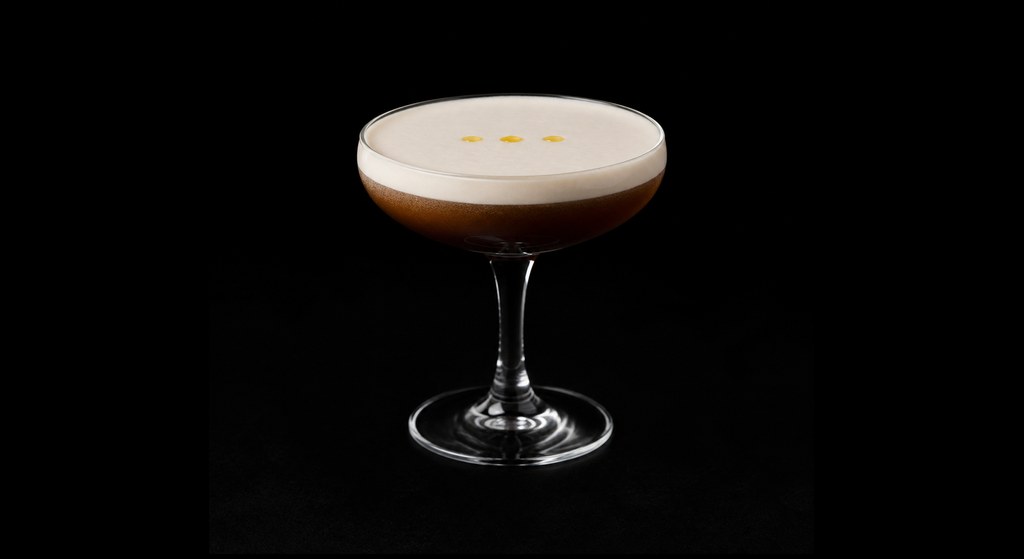 Olive Temptation cocktail on a dark studio background
