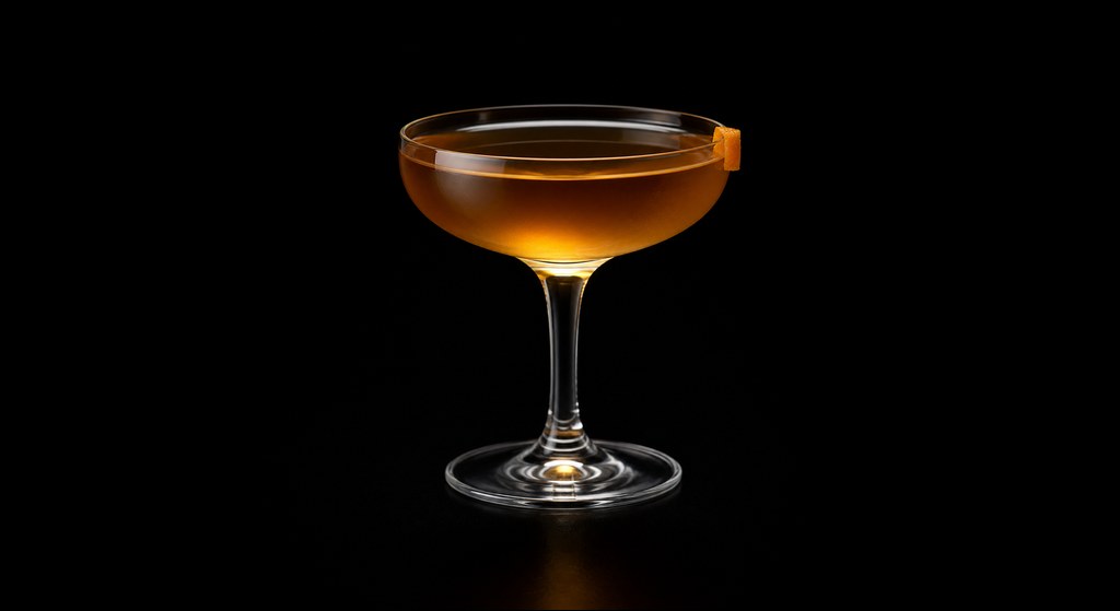 Omedetai Tricentenaire cocktail on a dark studio background
