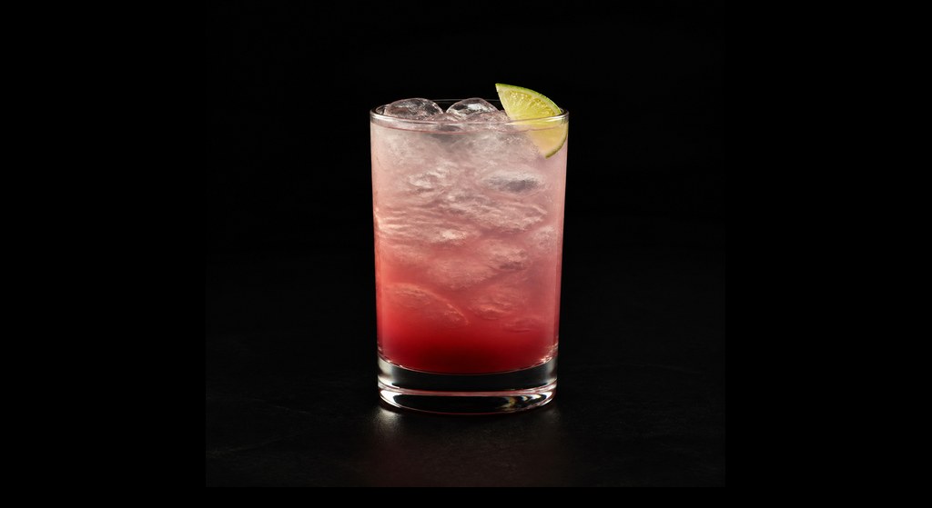 Original Tequila Sunrise cocktail on a dark studio background