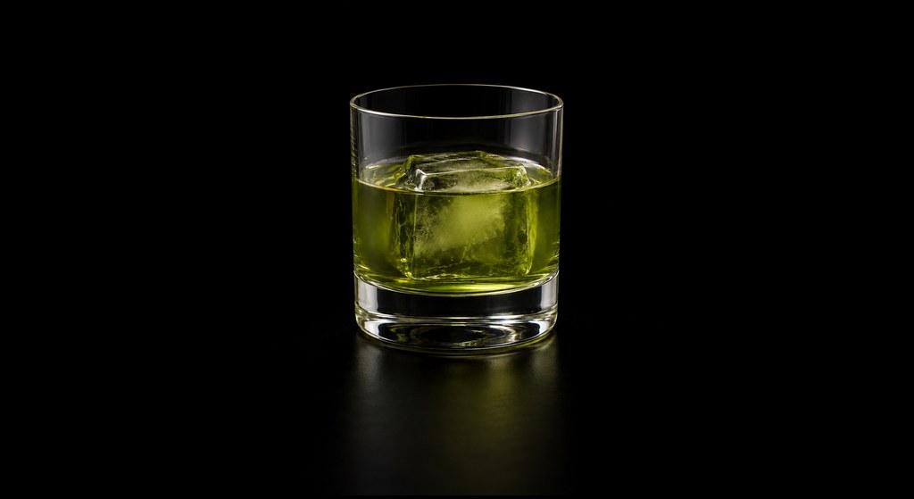 Pandan Negroni cocktail on a dark studio background