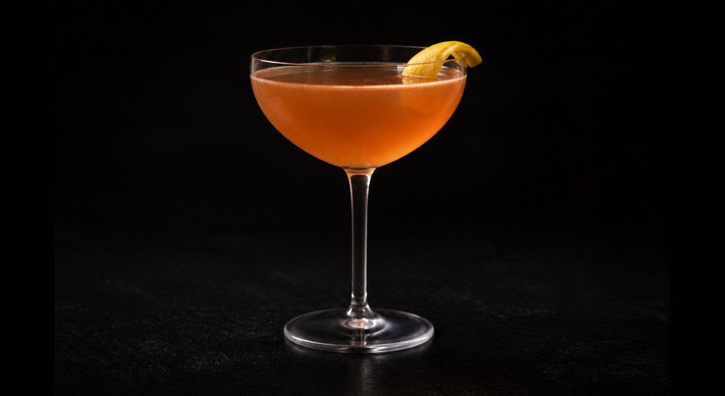 Paper Plane cocktail on a dark studio background