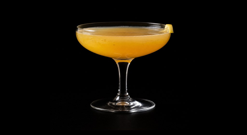 Passepartout cocktail on a dark studio background