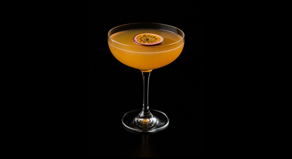 Passion Fruit Cocktail cocktail on a dark studio background