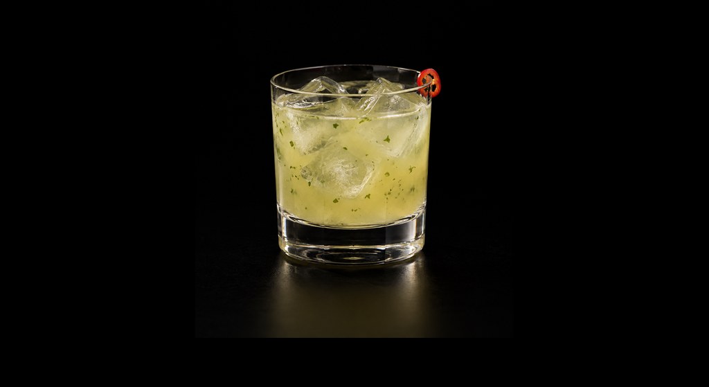 Picante de la Casa cocktail on a dark studio background