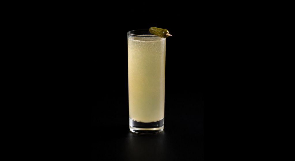 Pickleback Fizz cocktail on a dark studio background