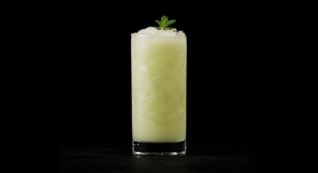 Piña Verde cocktail on a dark studio background