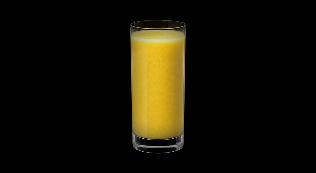Pineapple Gingerale Smoothie cocktail on a dark studio background