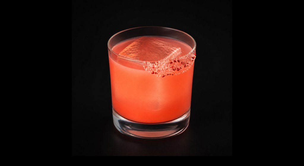Pink Elephant cocktail on a dark studio background