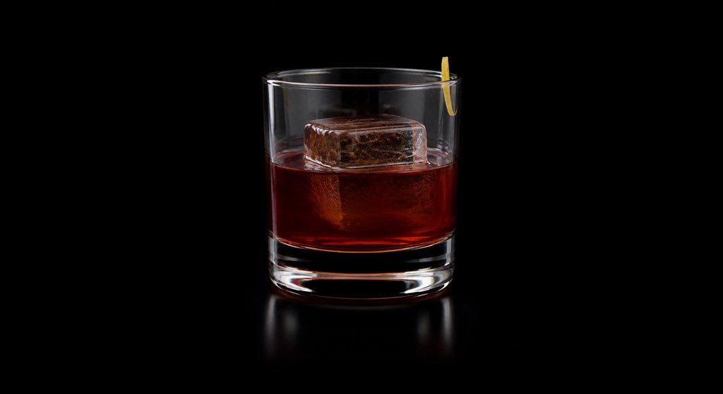 Pinto (by J. E. Clapham) cocktail on a dark studio background