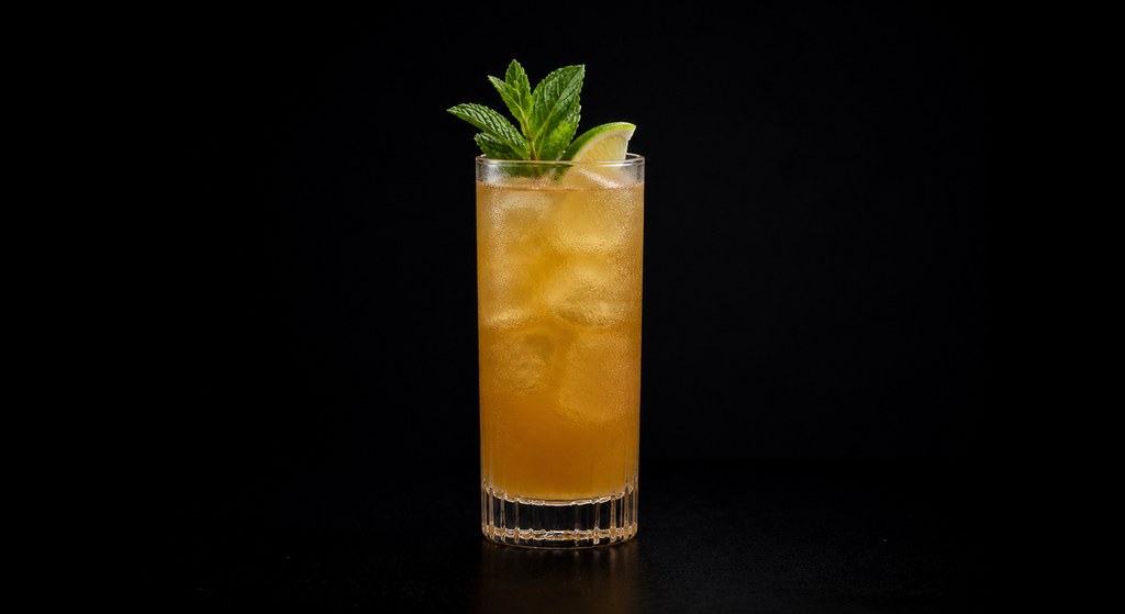 Planter's Punch cocktail on a dark studio background